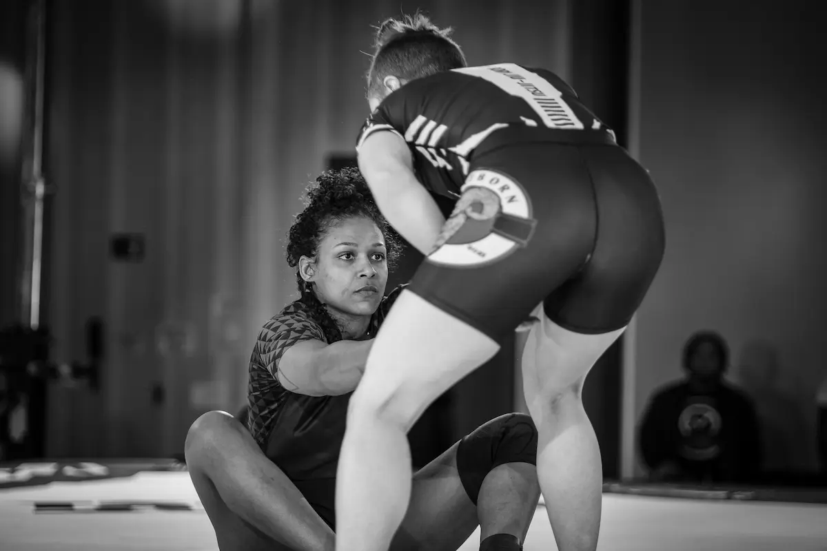 Suellen 'Susu' Lima De Souza training, smiling mid-roll.